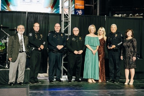  west valley law enforcement officials accepting award on a stage