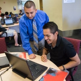 Two Students working at a computer in Gaucho Advisement