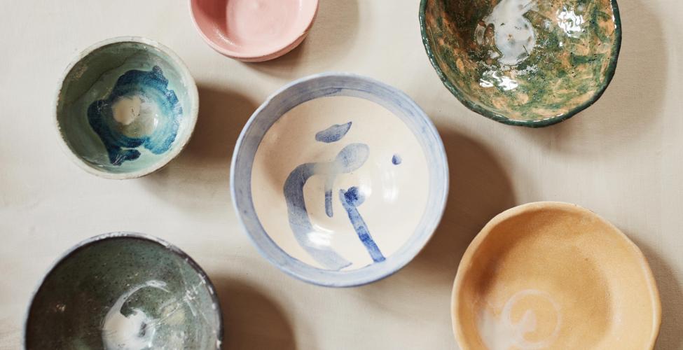 Colorful ceramic bowls on a table.