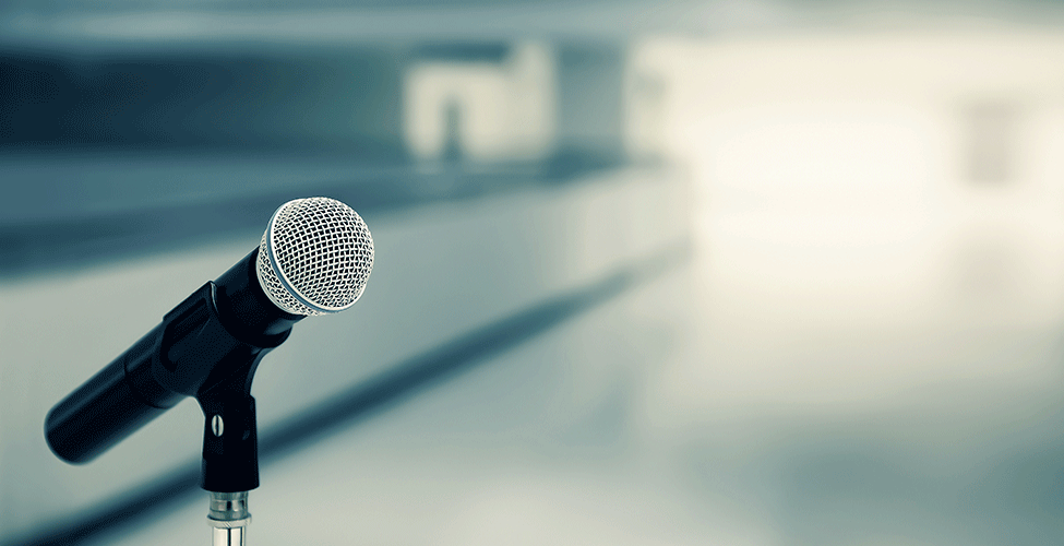 Microphone against a  window with light streaming in.