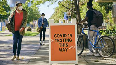 COVID-19 testing sign on college campus