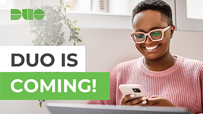 Female student sitting at a laptop and using a phone with the words "DUO is Coming!"