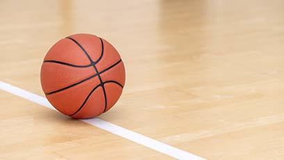 Basketball on an empty court.