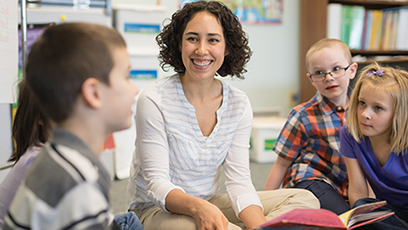 Female teacher reading to students