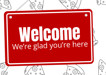 Red hanging sign with the words, "Welcome, we're glad you're here," in white.