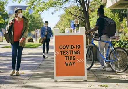 COVID-19 testing sign on college campus