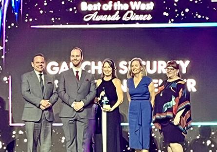 Receiving the award are Drew Nichols - Lead Engineer GSOC, Chad Stroot - Lead Analyst GSOC, Rachelle Hall, Susan Campbell, and Tiffany Hernandez.