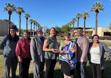 GCC employees receiving the Shining Star Award from Peoria Chamber CEO and President Rhonda Carlson.