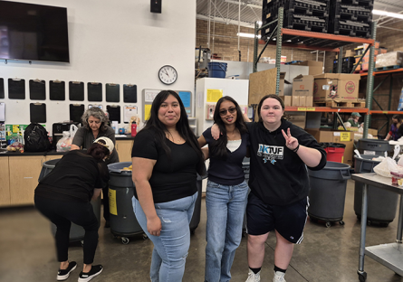 DECA students volunteering at Vineyard Food & Clothing Bank
