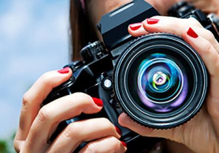 Student holding a camera.