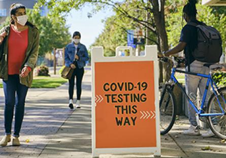 COVID-19 testing sign on college campus