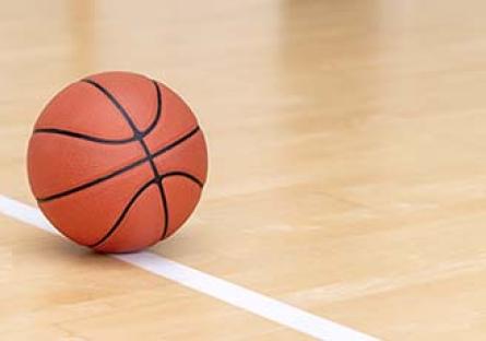 Basketball on an empty court.