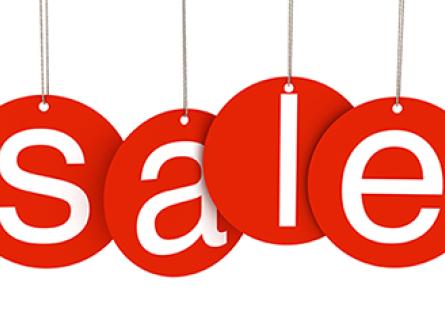 Red hanging sale letter tags, the word "sale" spelled in white.