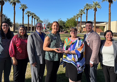 GCC employees receiving the Shining Star Award from Peoria Chamber CEO and President Rhonda Carlson.