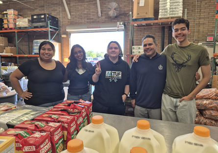 DECA students volunteering at Vineyard Clothing & Food Bank
