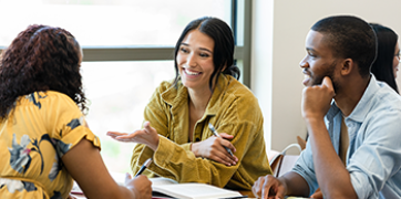 A group of business students discussing an assignment.