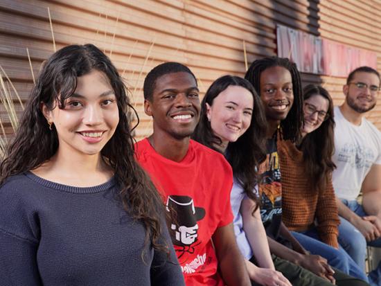 Students sitting outside the Library Media Center.