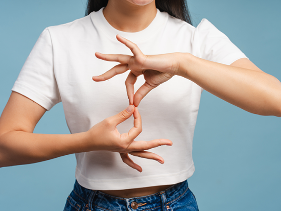 Young woman using sign language.