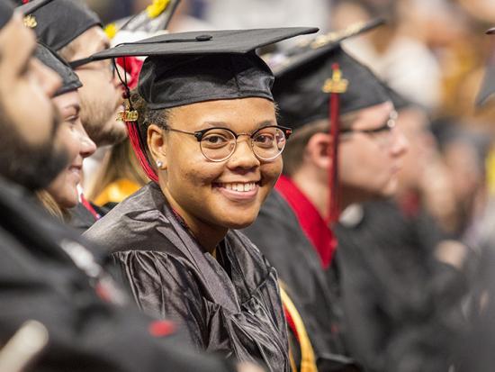 Student in Graduation Cap & Gown
