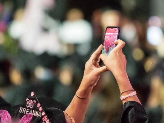 Student with Cell Phone Camera