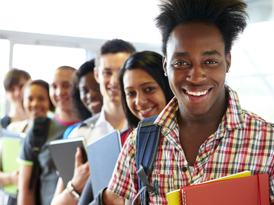 Smiling students standing in line