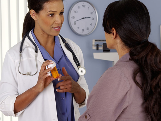 Medical Interpreter discussing medication with a patient.