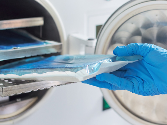 Sterile Processing Technician sterilizing medical equipment.