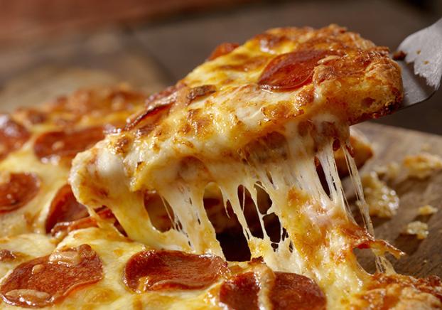 A picture of pizza being served