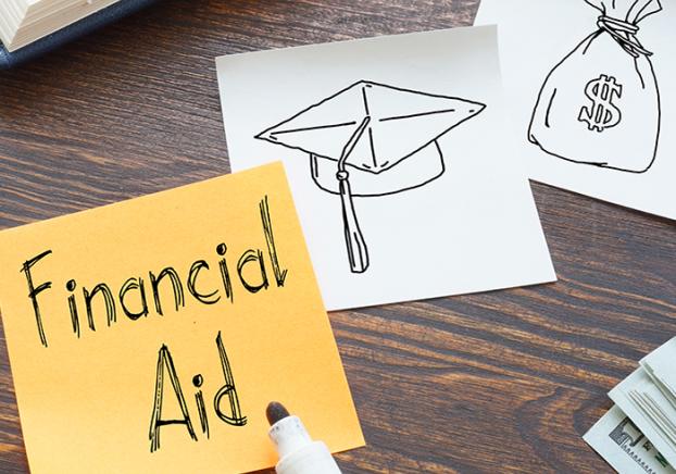 Yellow sticky note with the words "Financial Aid" in black.