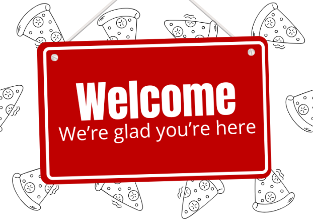 Red hanging sign with the words, "Welcome, we're glad you're here," in white.