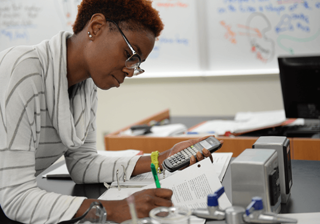 Image of student studying on campus