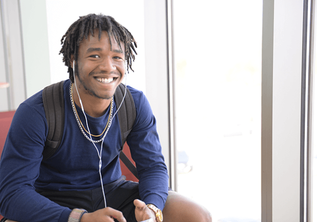 Smiling student at the GCC Main campus