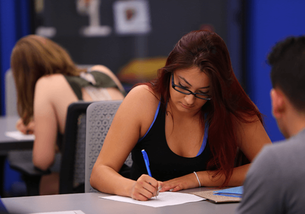 Economics students studying at a table